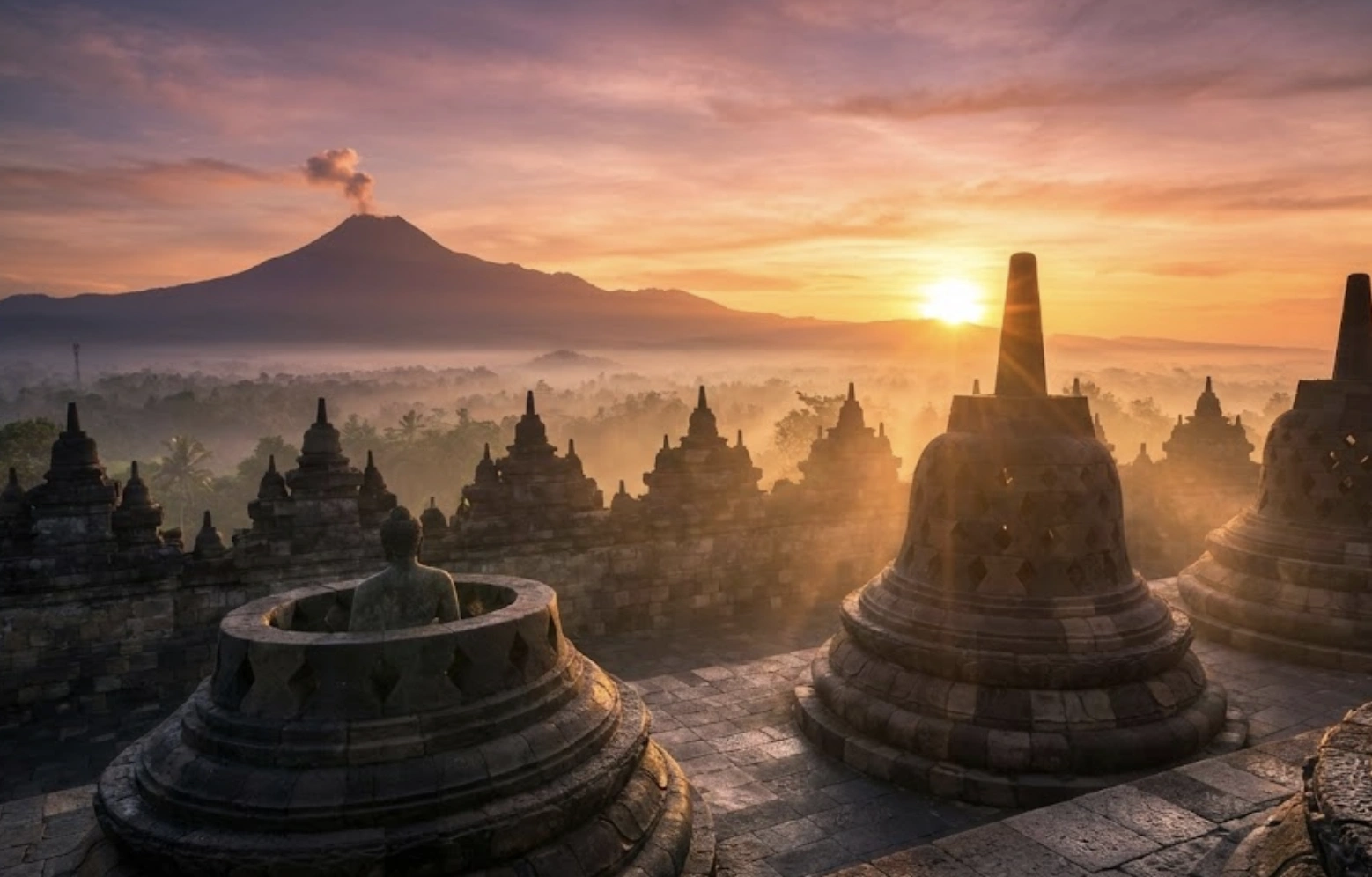 Sunrise over Borobudur Temple with Mount Merapi in background